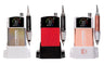 KUPA MANIPro Passport NEXT nail drill shown in three colors — Unicorn, red, and Rose Gold — each in a charging dock with handpiece