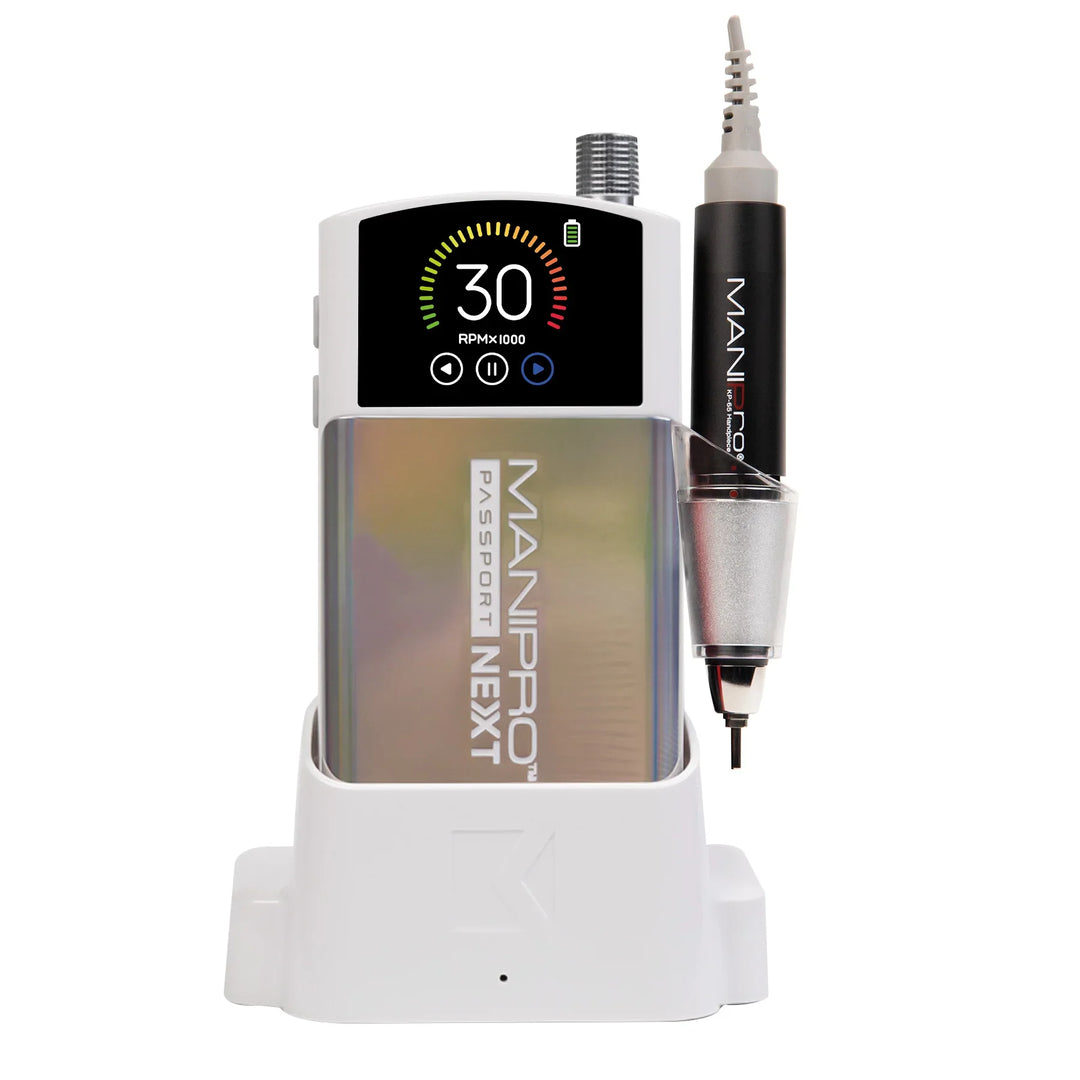 KUPA MANIPro Passport NEXT nail drill in Unicorn holographic finish, front view in white charging dock with handpiece