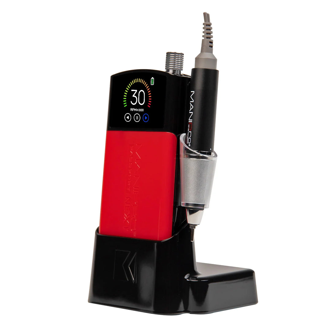 KUPA MANIPro Passport NEXT nail drill in Black with red jacket, angled side view in black charging dock with handpiece